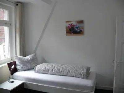 Ein Bett oder Betten in einem Zimmer der Unterkunft Ferienwohnung Speyer