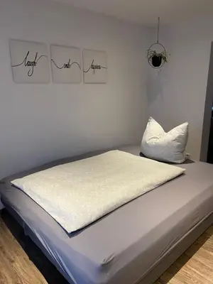 Ein Bett oder Betten in einem Zimmer der Unterkunft Ferienwohnung Jasmin