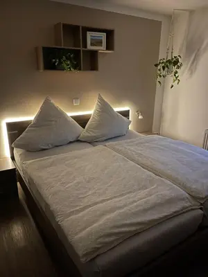 Ein Bett oder Betten in einem Zimmer der Unterkunft Ferienwohnung Jasmin