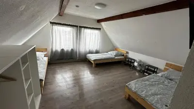 Ein Bett oder Betten in einem Zimmer der Unterkunft Mulinhouse Lingenfeld