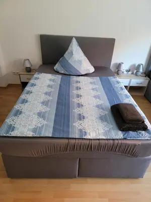 Ein Bett oder Betten in einem Zimmer der Unterkunft City Apartment KL