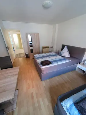Ein Bett oder Betten in einem Zimmer der Unterkunft City Apartment KL