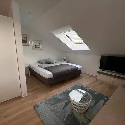 Ein Bett oder Betten in einem Zimmer der Unterkunft Ferienwohnungen Auf der Höhe