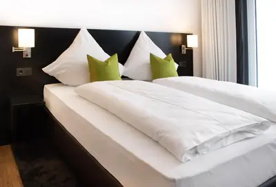 Ein Bett oder Betten in einem Zimmer der Unterkunft STO Hotel by WMM Hotels