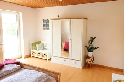 Ein Bett oder Betten in einem Zimmer der Unterkunft Gutenberg - helle und geräumige Wohnung in Uninähe