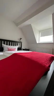 Ein Bett oder Betten in einem Zimmer der Unterkunft Hotel & Restaurant Zum Karpfen