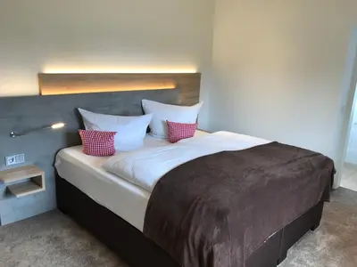 Ein Bett oder Betten in einem Zimmer der Unterkunft Hotel & Restaurant Zum Karpfen
