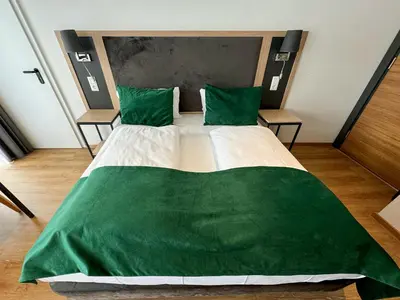 Ein Bett oder Betten in einem Zimmer der Unterkunft DORMERO Hotel Rüsselsheim