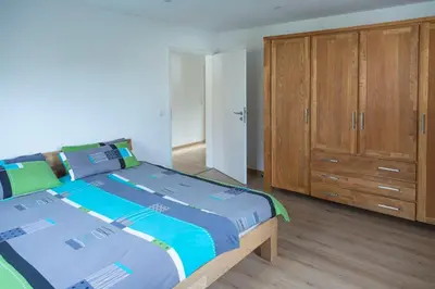 Ein Bett oder Betten in einem Zimmer der Unterkunft Ferienwohnung Zum Bienenstock