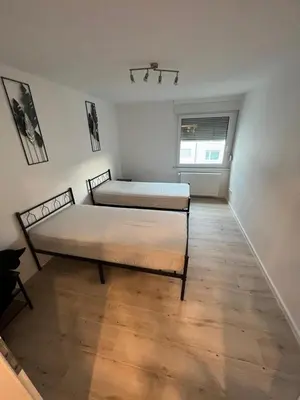 Ein Bett oder Betten in einem Zimmer der Unterkunft Monteurwohnung Mühlacker - L8 Street