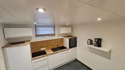 Küche/Küchenzeile in der Unterkunft Handwerkerwohnung-Monteurunterkunft