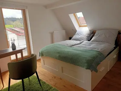 Ein Bett oder Betten in einem Zimmer der Unterkunft Ausblick Maisenbach, Talstraße