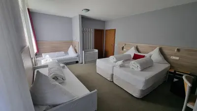 Ein Bett oder Betten in einem Zimmer der Unterkunft MATZ Brunnenhof