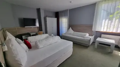 Ein Bett oder Betten in einem Zimmer der Unterkunft MATZ Brunnenhof