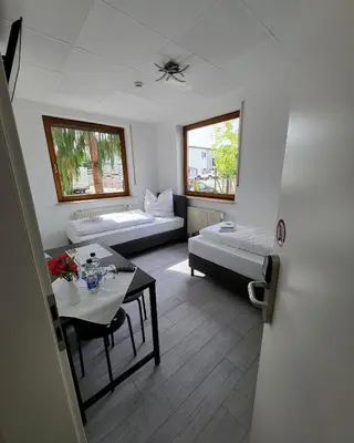 Ein Bett oder Betten in einem Zimmer der Unterkunft Zimmerwelt-Ilsfeld