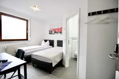 Ein Bett oder Betten in einem Zimmer der Unterkunft Zimmerwelt-Ilsfeld