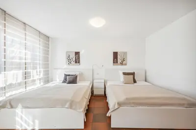 Ein Bett oder Betten in einem Zimmer der Unterkunft Gästehaus Hartwig