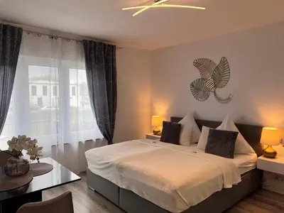 Ein Bett oder Betten in einem Zimmer der Unterkunft Prime Host Lovely Apartment