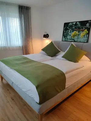 Ein Bett oder Betten in einem Zimmer der Unterkunft Gästezimmer / Weingut Peter