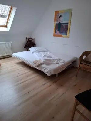 Ein Bett oder Betten in einem Zimmer der Unterkunft Gästezimmer / Weingut Peter