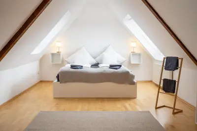 Ein Bett oder Betten in einem Zimmer der Unterkunft Große 3-Zimmer Maisonette Wohnung in Neuhausen