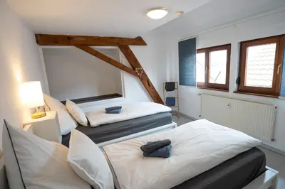 Ein Bett oder Betten in einem Zimmer der Unterkunft Große 3-Zimmer Maisonette Wohnung in Neuhausen