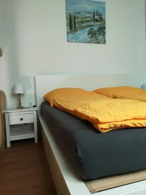 Ein Bett oder Betten in einem Zimmer der Unterkunft gemütliches Sandsteinhaus