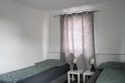 Ein Bett oder Betten in einem Zimmer der Unterkunft KiRoom Willsbach 2 und 3