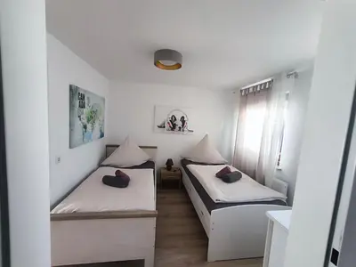 Ein Bett oder Betten in einem Zimmer der Unterkunft La Casa Suciu