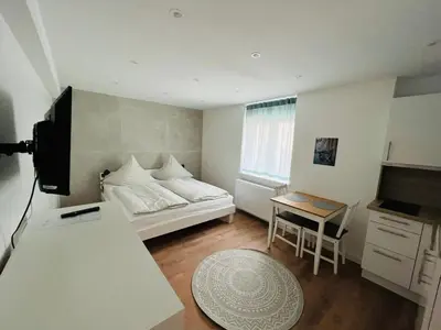 Ein Bett oder Betten in einem Zimmer der Unterkunft Ferienwohnung K Heidelberg Sandhausen