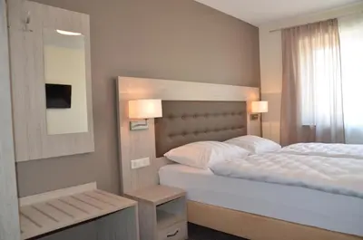 Ein Bett oder Betten in einem Zimmer der Unterkunft Pension die kleine Träumerei
