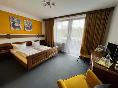 Ein Bett oder Betten in einem Zimmer der Unterkunft Hotelgasthof Schmucker