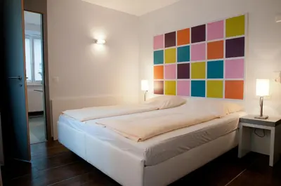 Ein Bett oder Betten in einem Zimmer der Unterkunft Altstadt Hotel Baunachshof