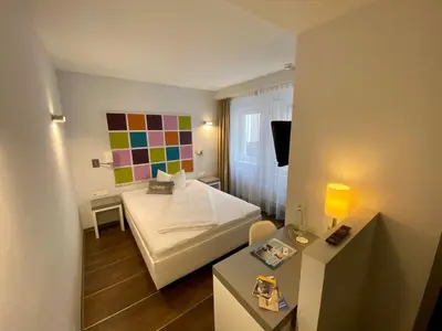 Ein Bett oder Betten in einem Zimmer der Unterkunft Altstadt Hotel Baunachshof