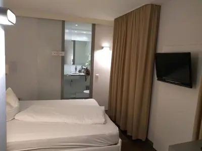 Ein Bett oder Betten in einem Zimmer der Unterkunft Altstadt Hotel Baunachshof