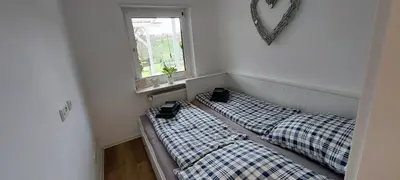 Ein Bett oder Betten in einem Zimmer der Unterkunft Tolle Untergeschoss-Wohnung für bis zu 5 Personen mit großem Garten und Terrasse