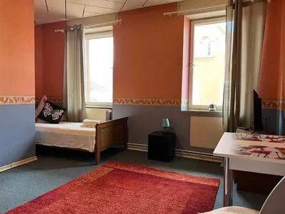 Ein Bett oder Betten in einem Zimmer der Unterkunft Ferienappartements Dolgesheim