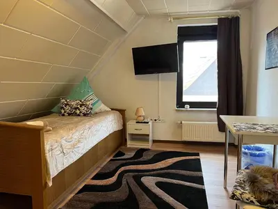 Ein Bett oder Betten in einem Zimmer der Unterkunft Ferienappartements Dolgesheim 2