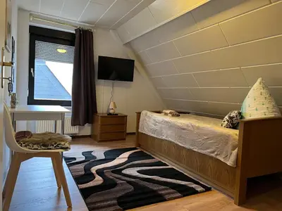 Ein Bett oder Betten in einem Zimmer der Unterkunft Ferienappartements Dolgesheim 4