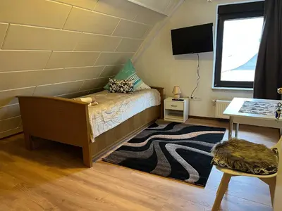 Ein Bett oder Betten in einem Zimmer der Unterkunft Ferienappartements Dolgesheim 4