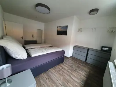 Ein Bett oder Betten in einem Zimmer der Unterkunft Ferienwohnung am Schönbach