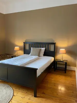 Ein Bett oder Betten in einem Zimmer der Unterkunft AUERSTEIN-Hotels auerstein & auerstein-mono