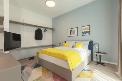 Ein Bett oder Betten in einem Zimmer der Unterkunft Candlewood Suites Heidelberg by IHG