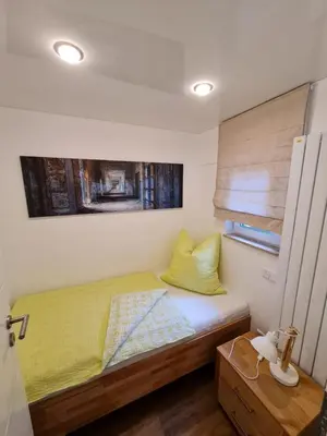 Ein Bett oder Betten in einem Zimmer der Unterkunft Apartment-1 Rödermark