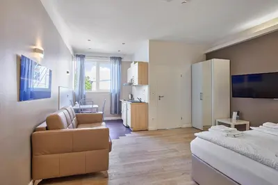 Ein Bett oder Betten in einem Zimmer der Unterkunft Boardinghotel Heidelberg