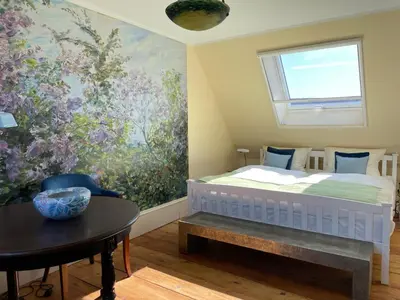 Ein Bett oder Betten in einem Zimmer der Unterkunft REFUGIUM Theresienstraße 19 - Chambre Slevogt