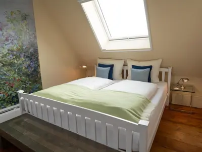 Ein Bett oder Betten in einem Zimmer der Unterkunft REFUGIUM Theresienstraße 19 - Chambre Slevogt