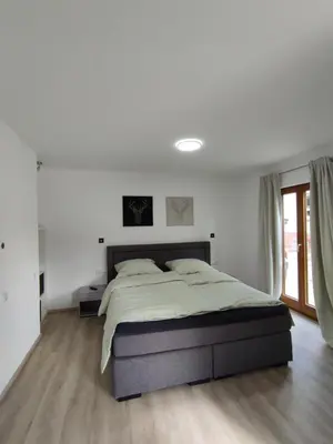 Ein Bett oder Betten in einem Zimmer der Unterkunft Ferienwohnung Steigner