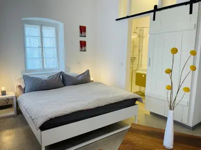 Ein Bett oder Betten in einem Zimmer der Unterkunft Auszeit - Historisches Ferienhaus in der Südpfalz