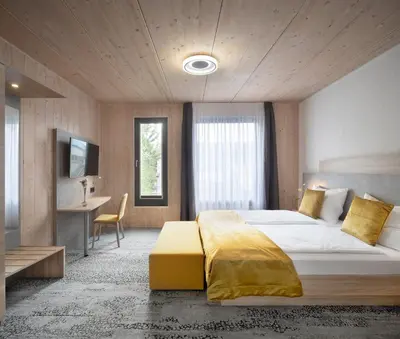 Ein Bett oder Betten in einem Zimmer der Unterkunft Ferienwohnungen im Vogelgesang W2